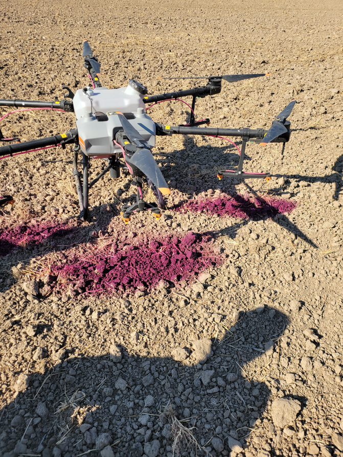 Closeup of drone on dirt.